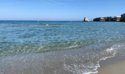 Sandy beach and cliffs in Torre dell'Orso, le due sorelle, Lecce, Italy